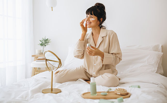 Woman Applying Face Cream