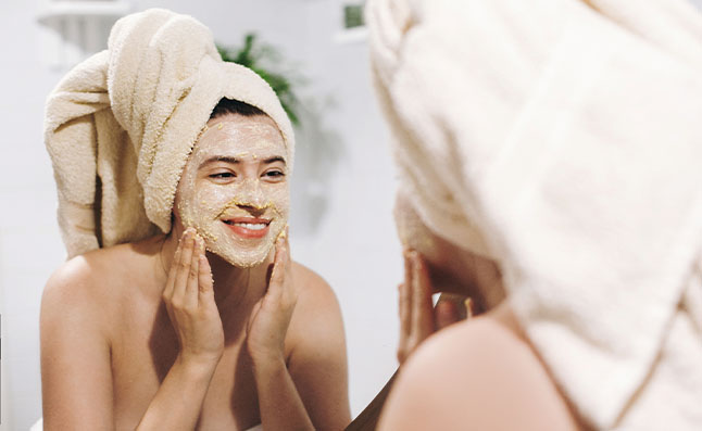 Woman Exfoliating Her Face