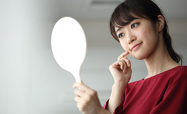 Woman With A Hand Mirror