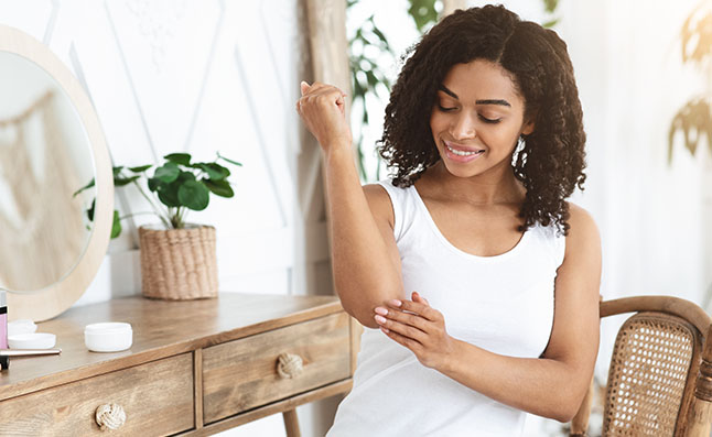 Woman Applying Hand Cream